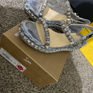Selling pre owned Christian Louboutin platform sandal.